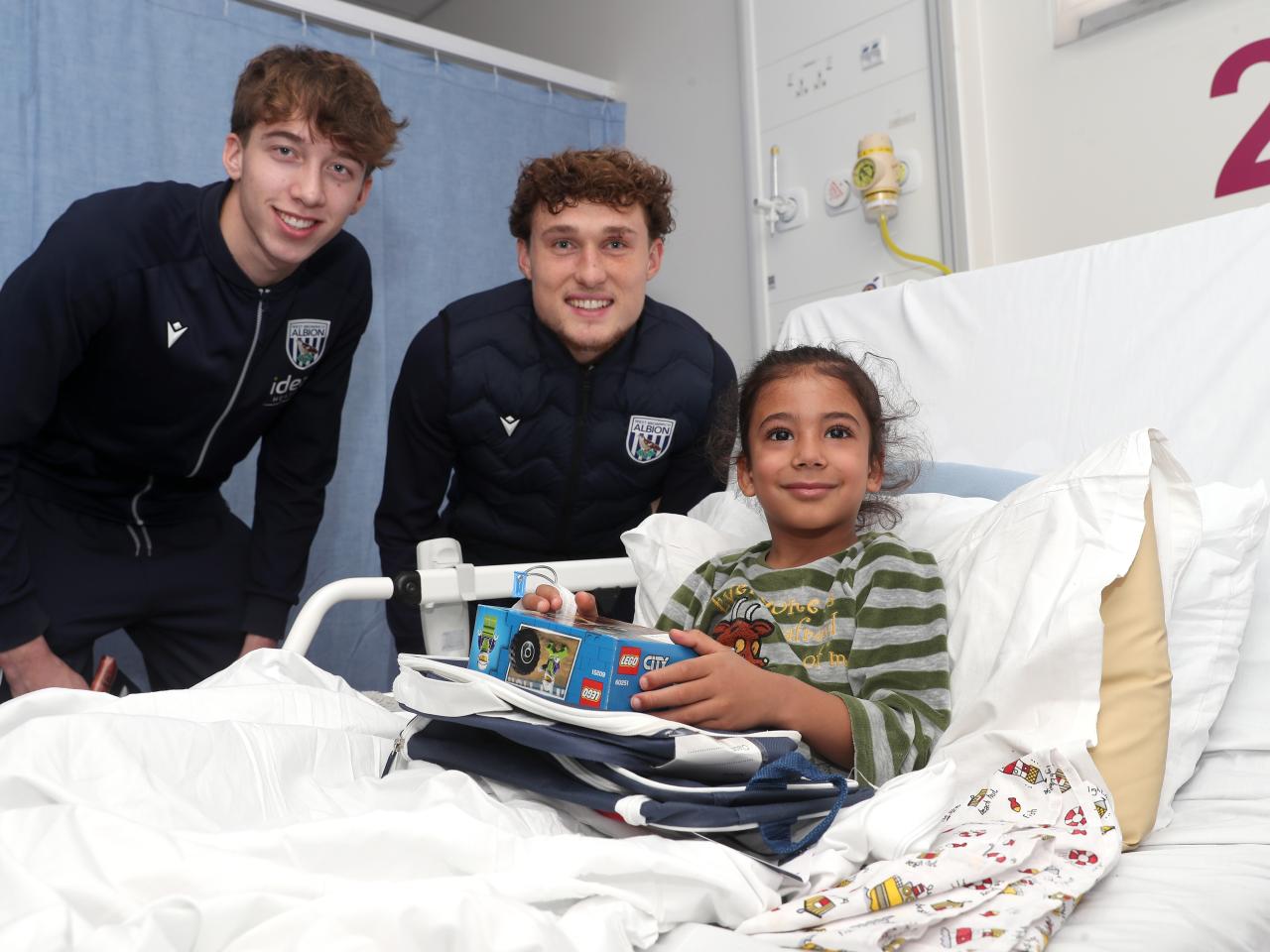 Albion players pose for a photo with a young patient at Midlands Metropolitan University Hospital 
