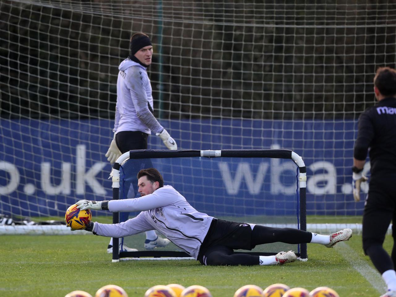 Joe Wildsmith diving down low to catch a ball in training 