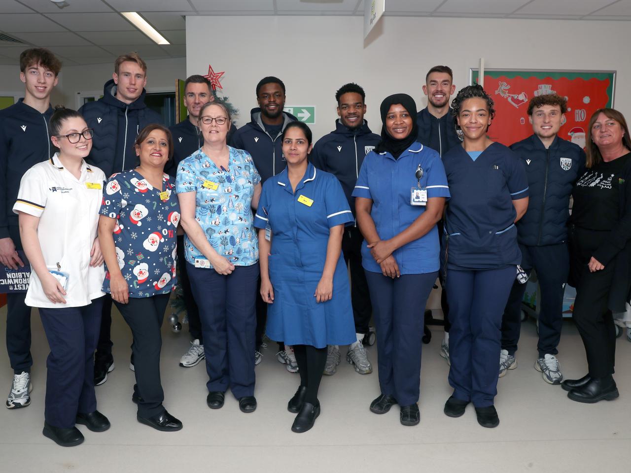 Albion players pose for a photo with NHS staff members at Midlands Metropolitan University Hospital 