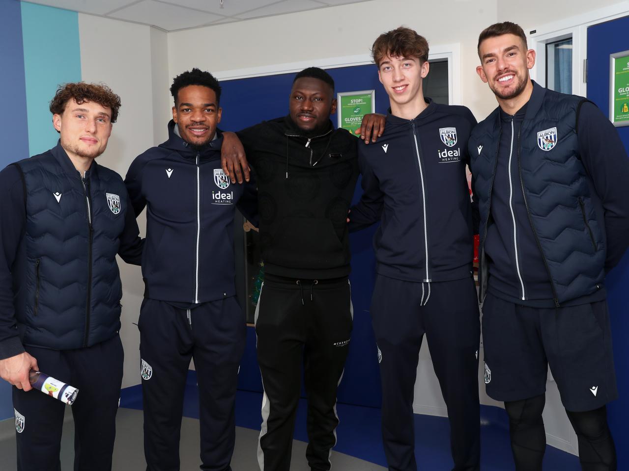 Albion players pose for a photo with a man at Midlands Metropolitan University Hospital 