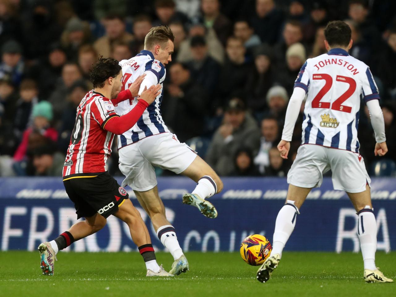 Torbjørn Heggem battling for the ball against Sheffield United in the home kit 