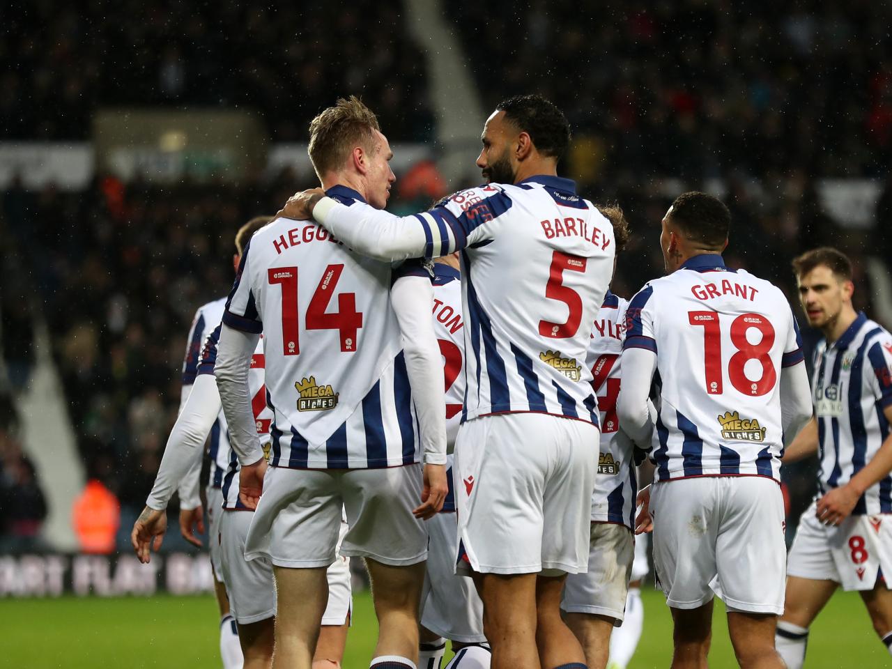 Torbjørn Heggem celebrates scoring a header against Sheffield United with team-mates 