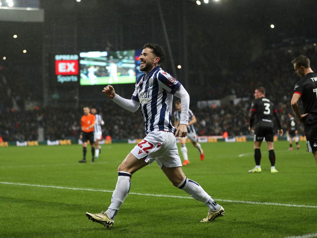 Mikey Johnston celebrates scoring a header against Bristol City 