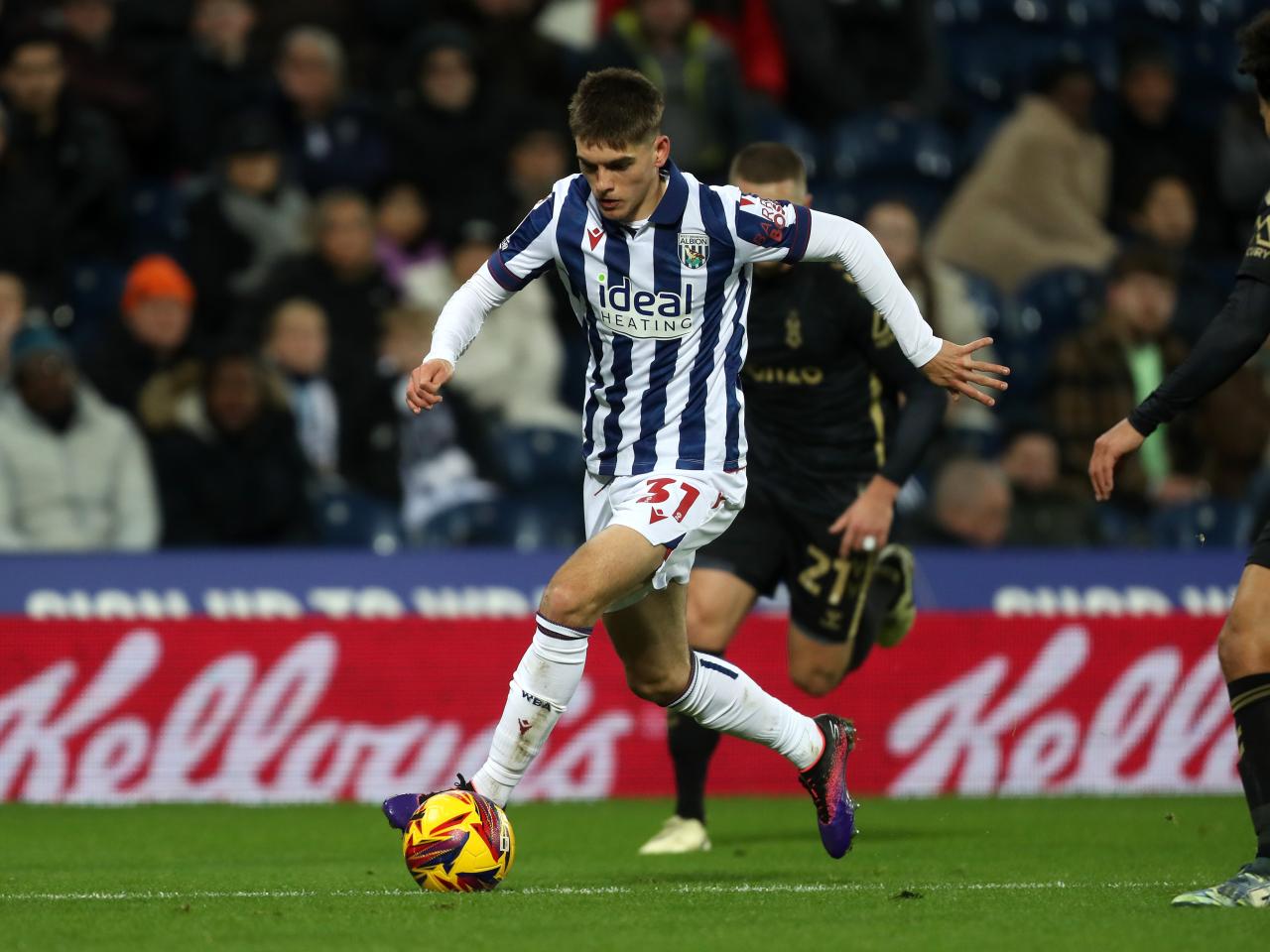 Tom Fellows running with the ball against Coventry City 