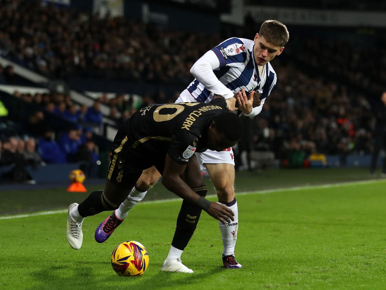 Tom Fellows challenging a Coventry City player 