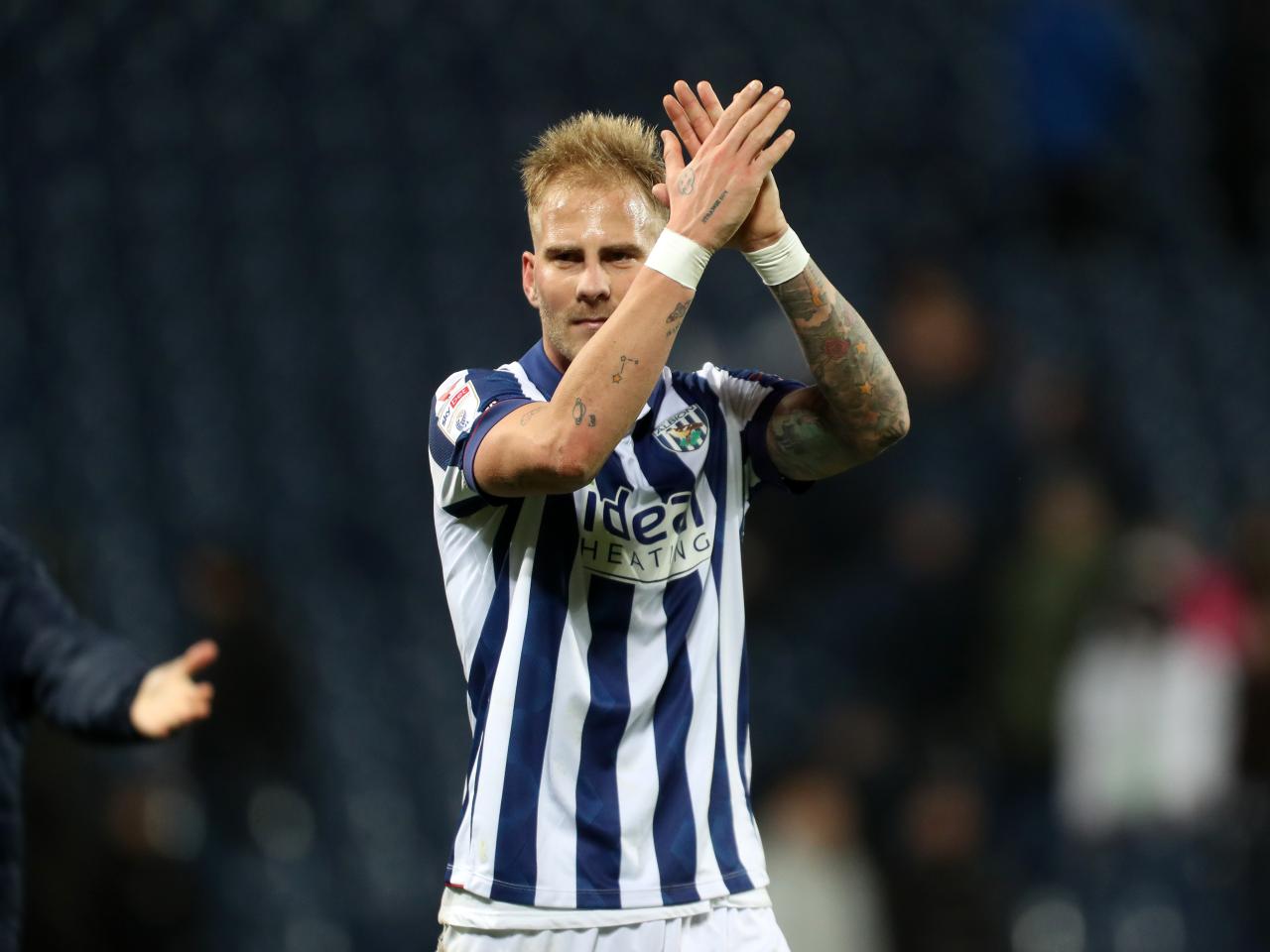 Uroš Račić applauds Albion fans following the win over Bristol City