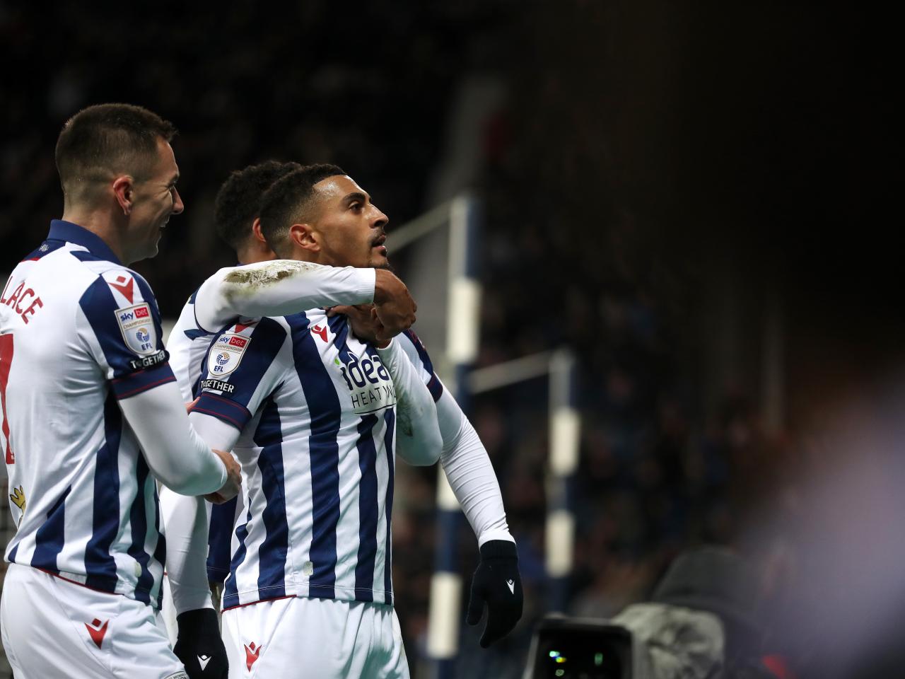 Karlan Grant celebrates scoring against Coventry City with team-mates