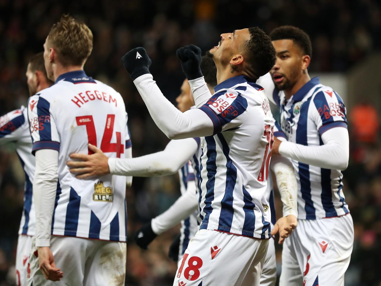 Karlan Grant celebrates scoring against Coventry City with team-mates