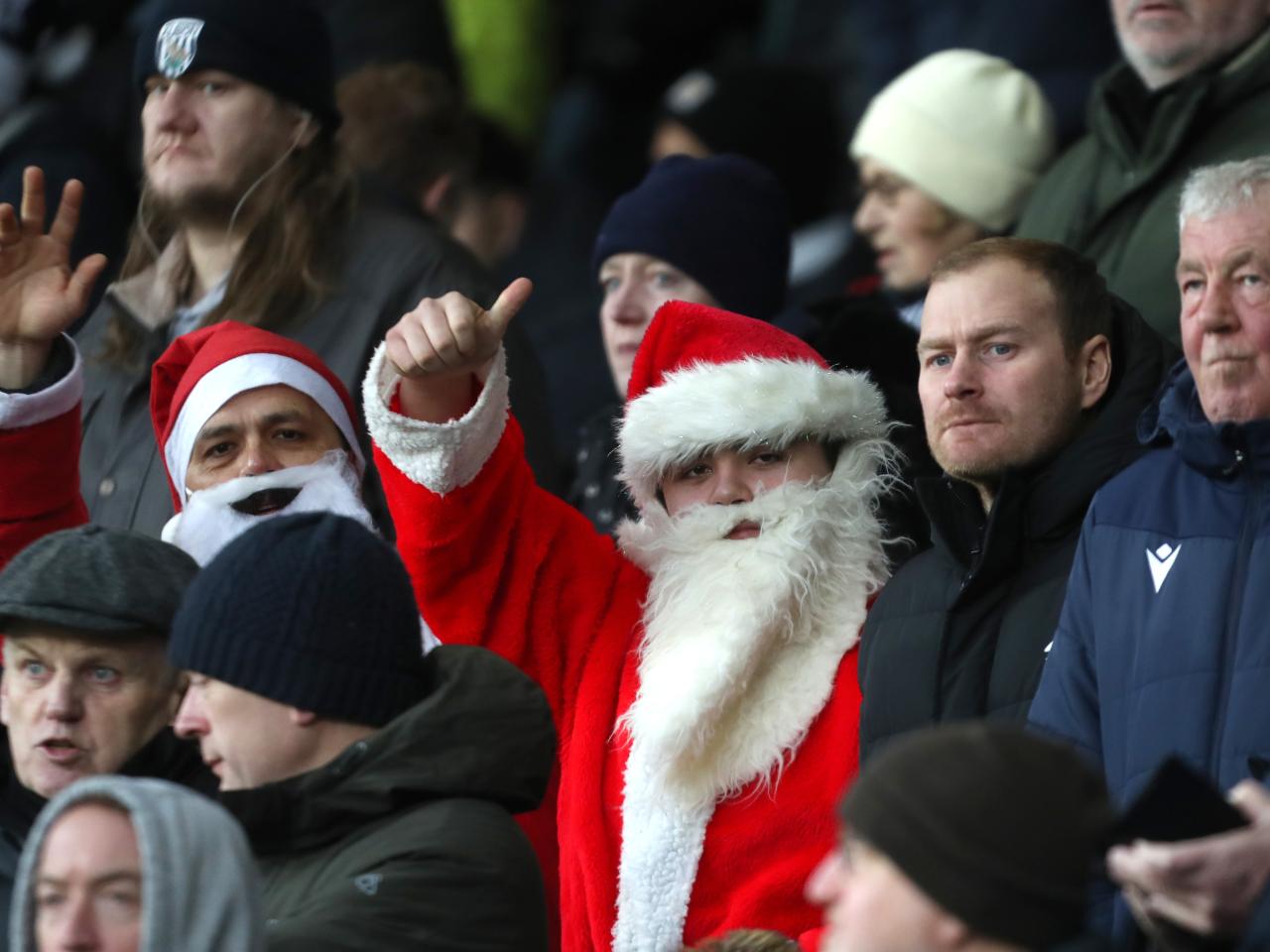 Albion fans dressed as Santa in the crowd at The Hawthorns against Bristol City