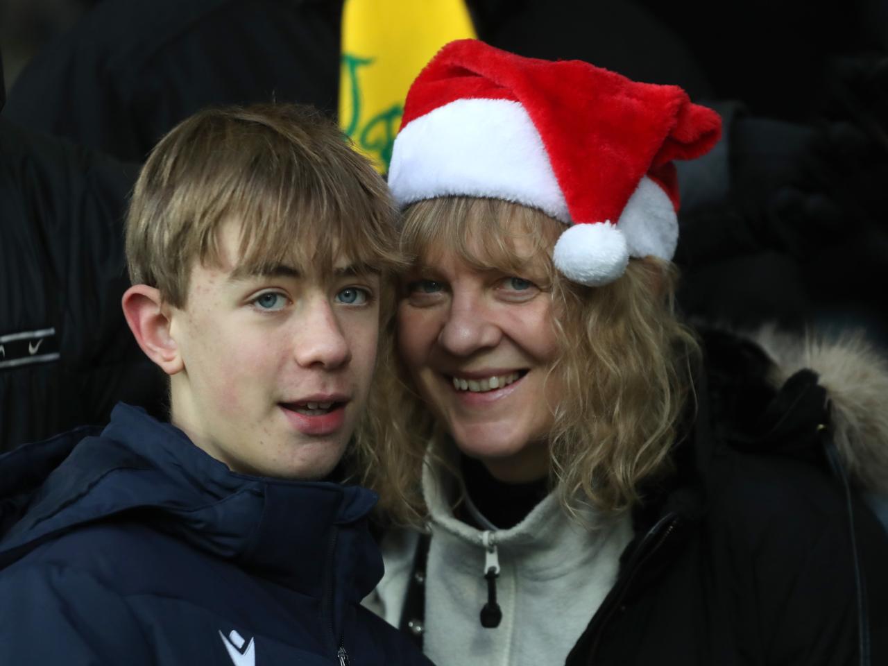 Albion fan with a Santa hat on in the crowd at The Hawthorns against Bristol City