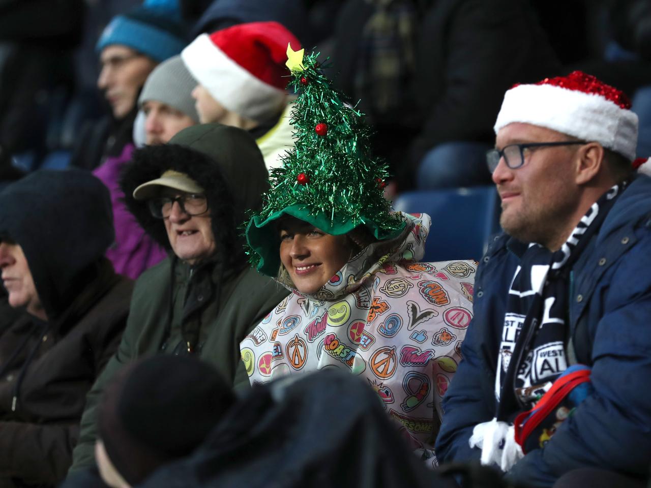 Albion fan with a Santa hat on in the crowd at The Hawthorns against Bristol City