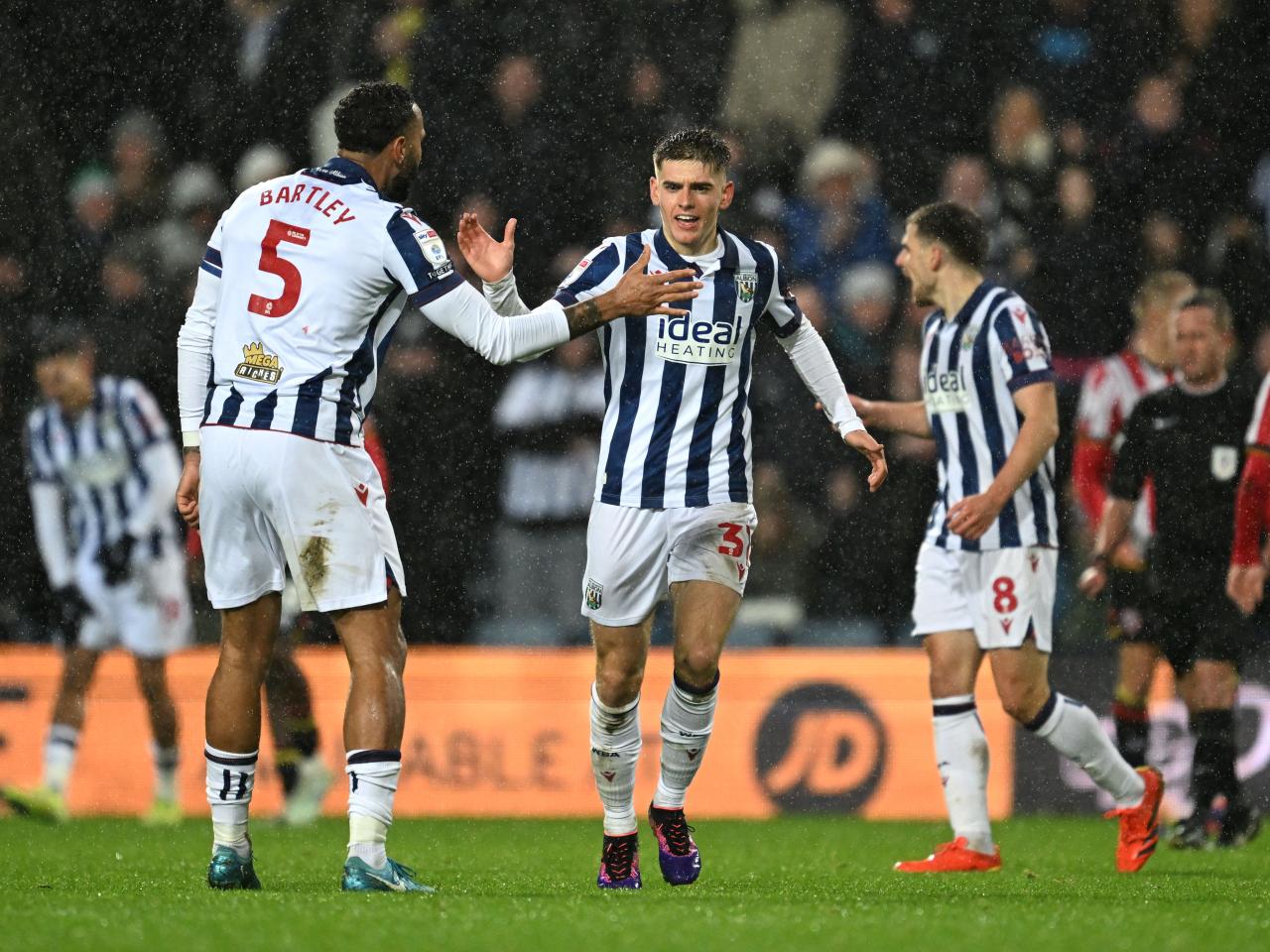 Tom Fellows celebrates scoring against Sheffield United with Kyle Bartley