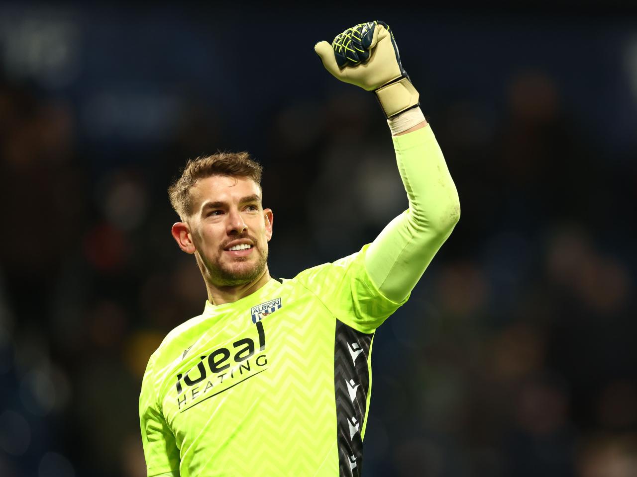 Alex Palmer celebrates beating Bristol City at full time 