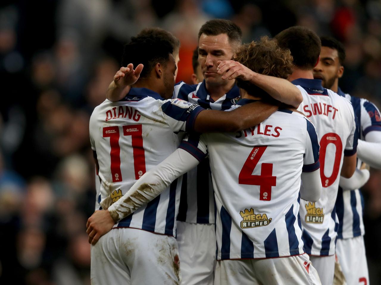 Grady Diangana celebrates with team-mates after scoring against Portsmouth
