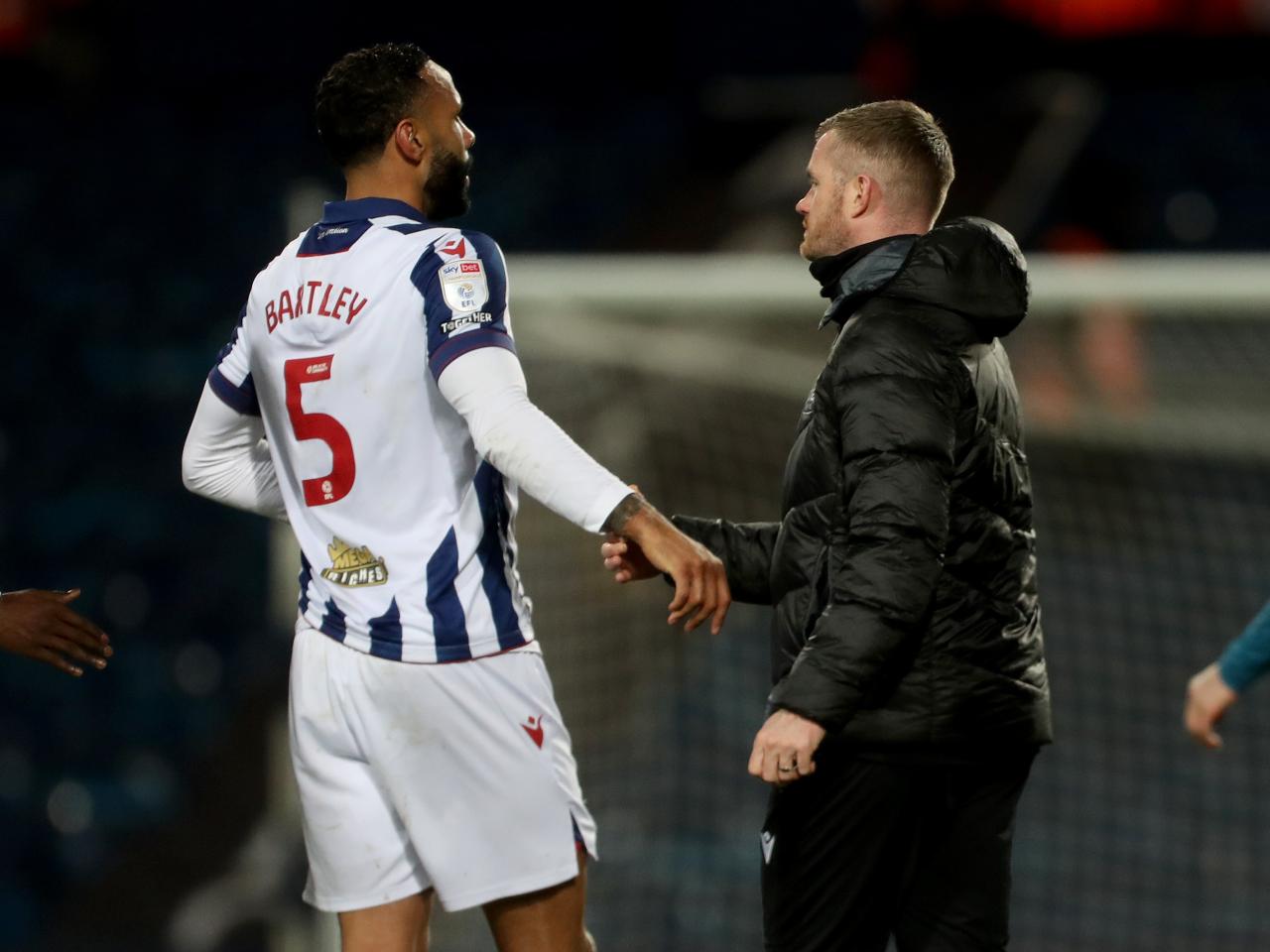 Chris Brunt and Kyle Bartley shaking hands after the win over Preston 