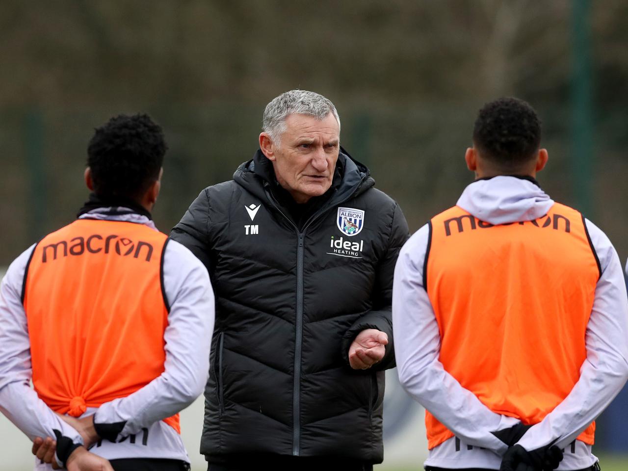 Tony Mowbray chatting to two Albion players