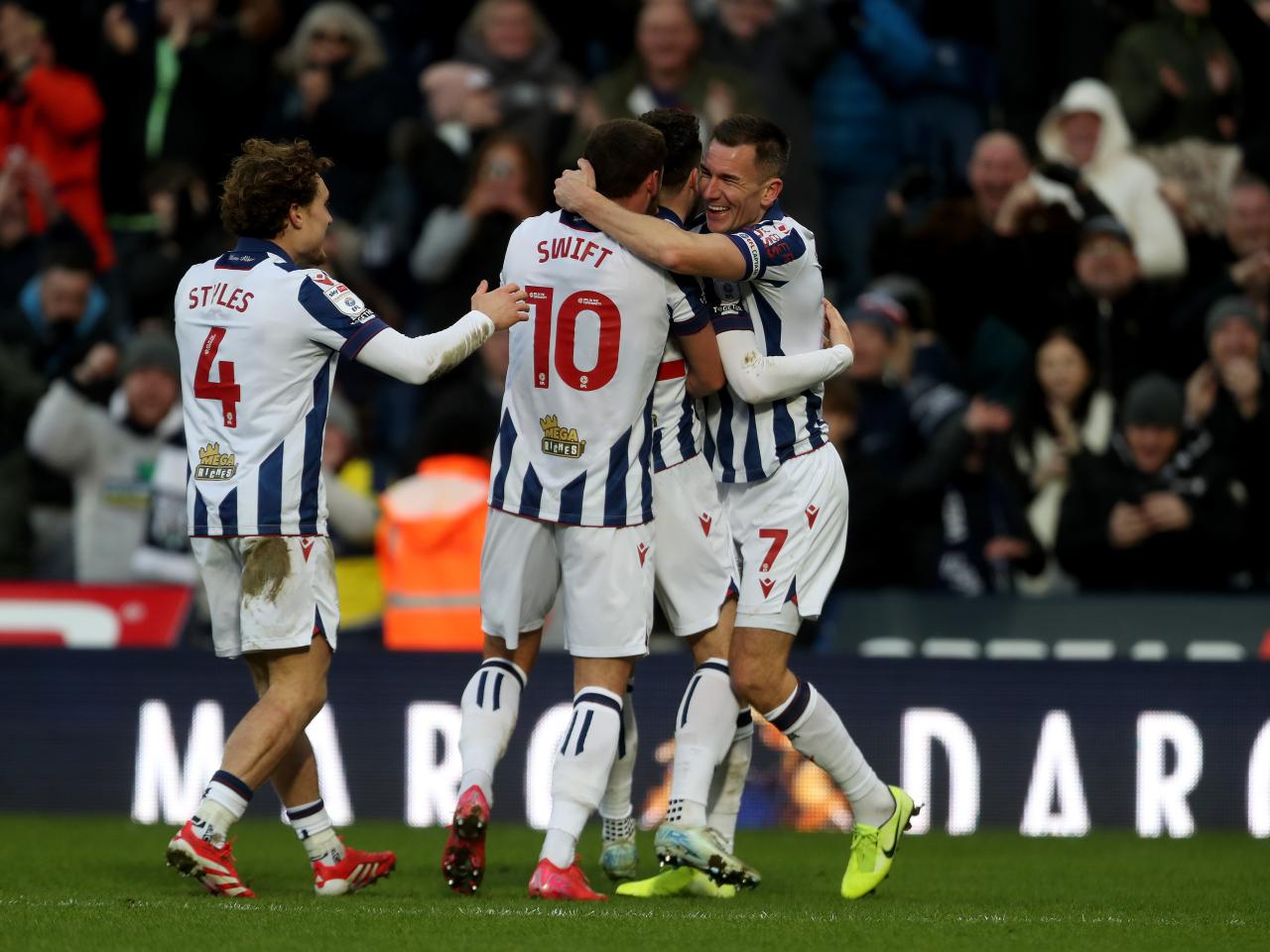 John Swift celebrates scoring against Portsmouth with team-mates