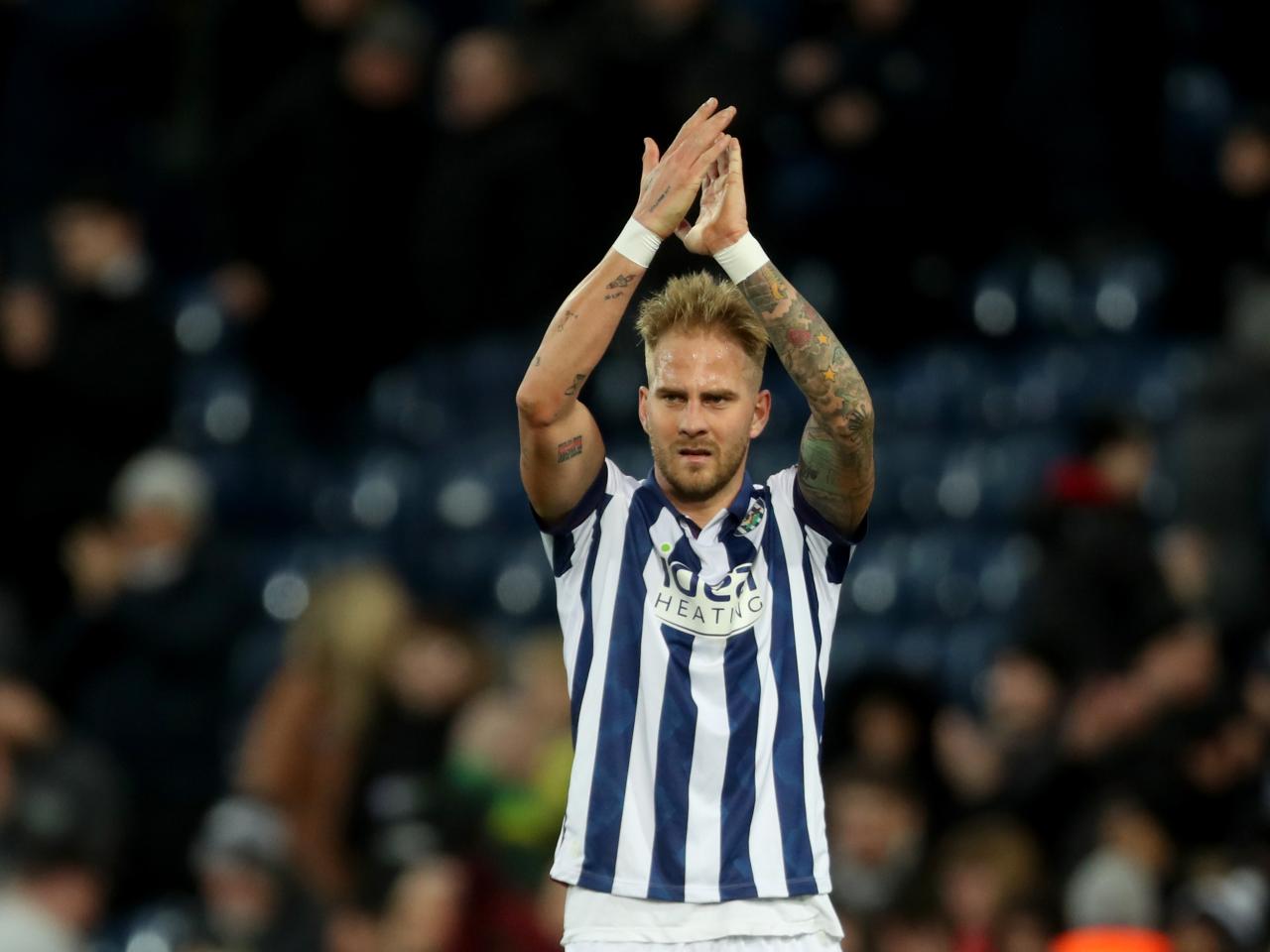 Uroś Račić applauding Albion fans after beating Portsmouth