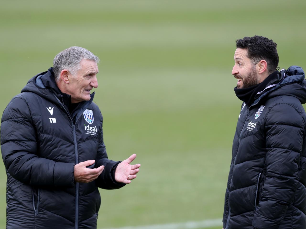 Tony Mowbray chatting to Damia Abella during a training session