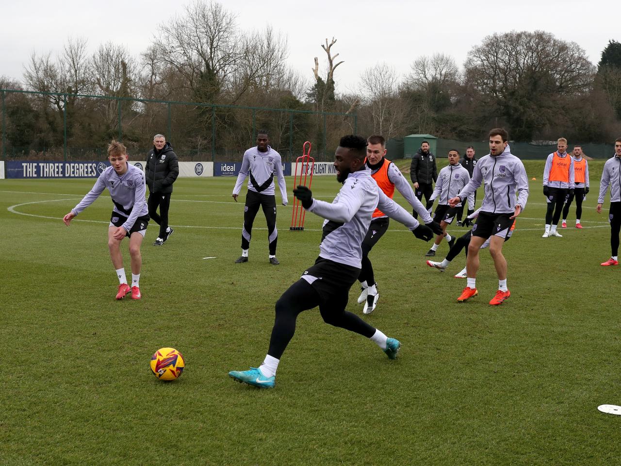 A general view of a training session with Tony Mowbray watching in the background