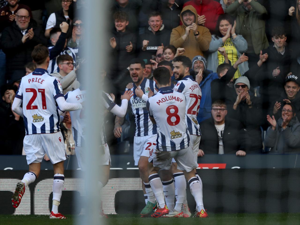 Alex Mowatt celebrates scoring against Oxford at The Hawthorns with team-mates 
