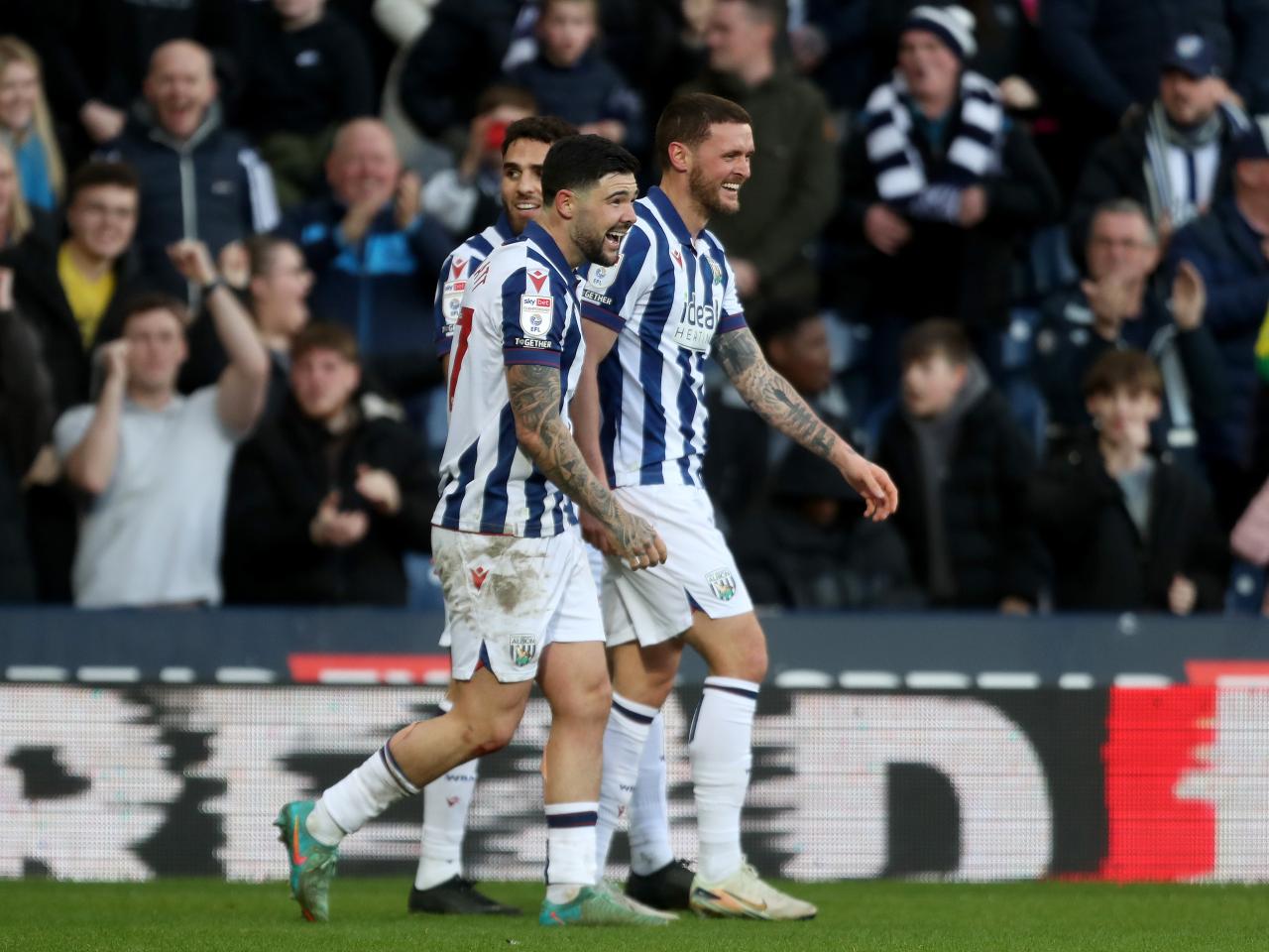 John Swift celebrates scoring against Oxford at The Hawthorns