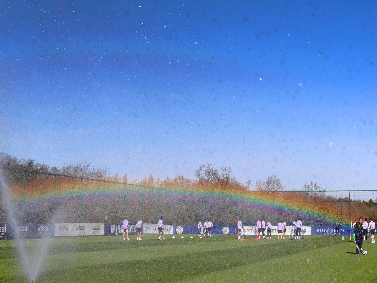 A general shot of training with a rainbow in the background 