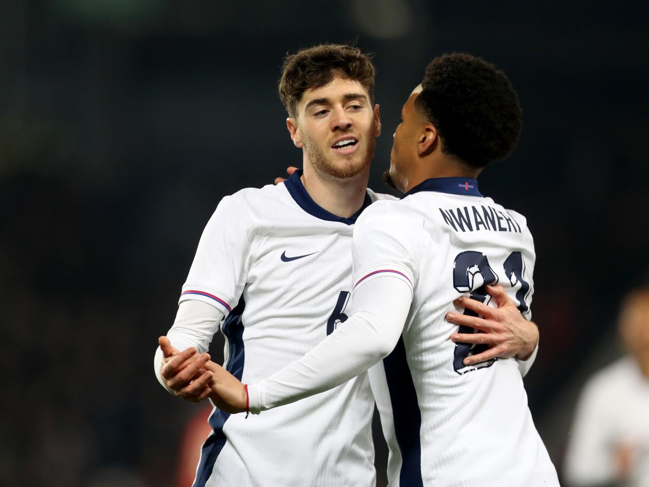 Two England players celebrate a goal scored against Portugal at The Hawthorns