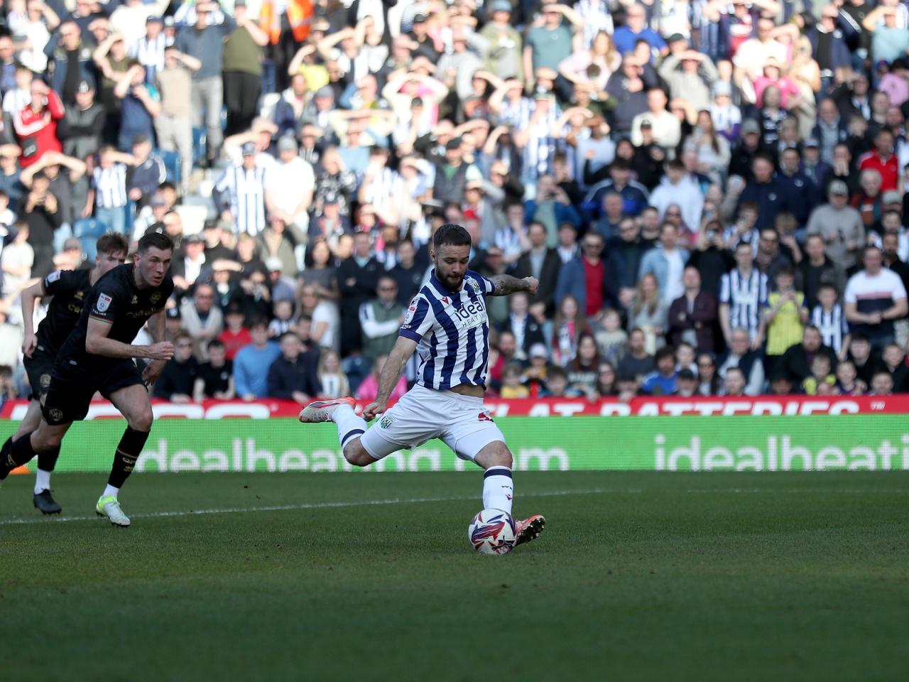Adam Armstrong takes a penalty against QPR 