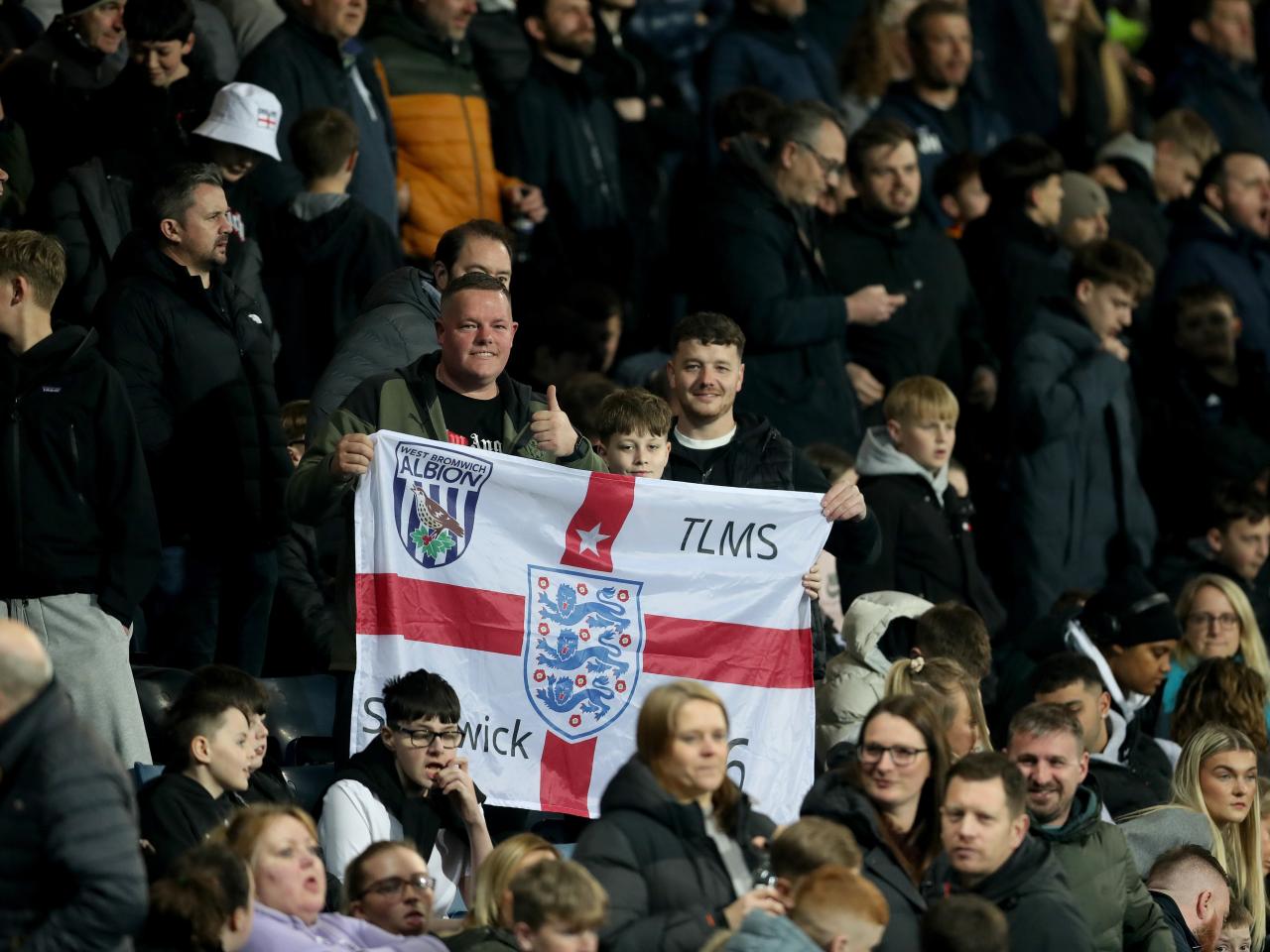 England fans in the stands at The Hawthorns with England flags