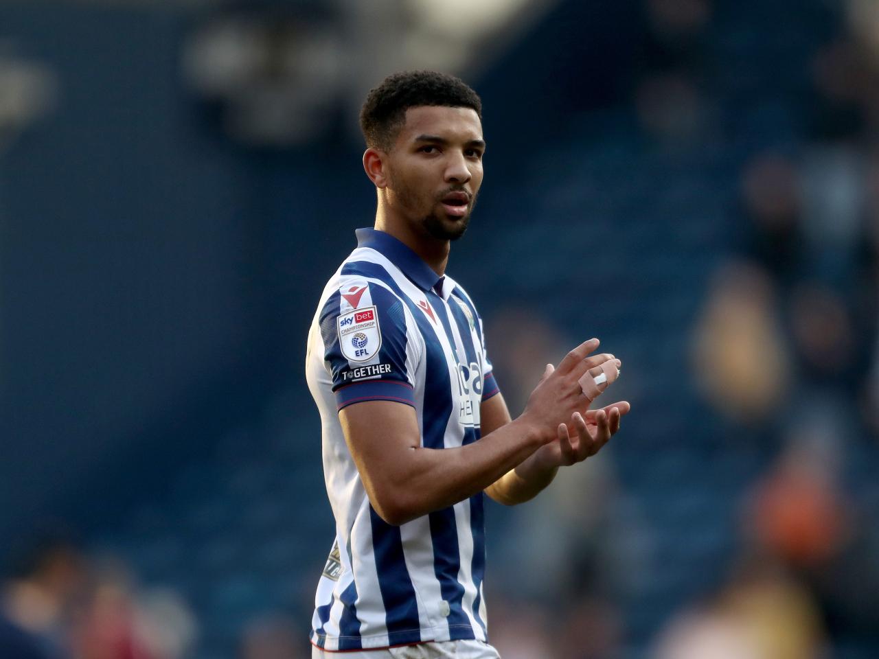 Mason Holgate applauds Albion fans after the QPR game