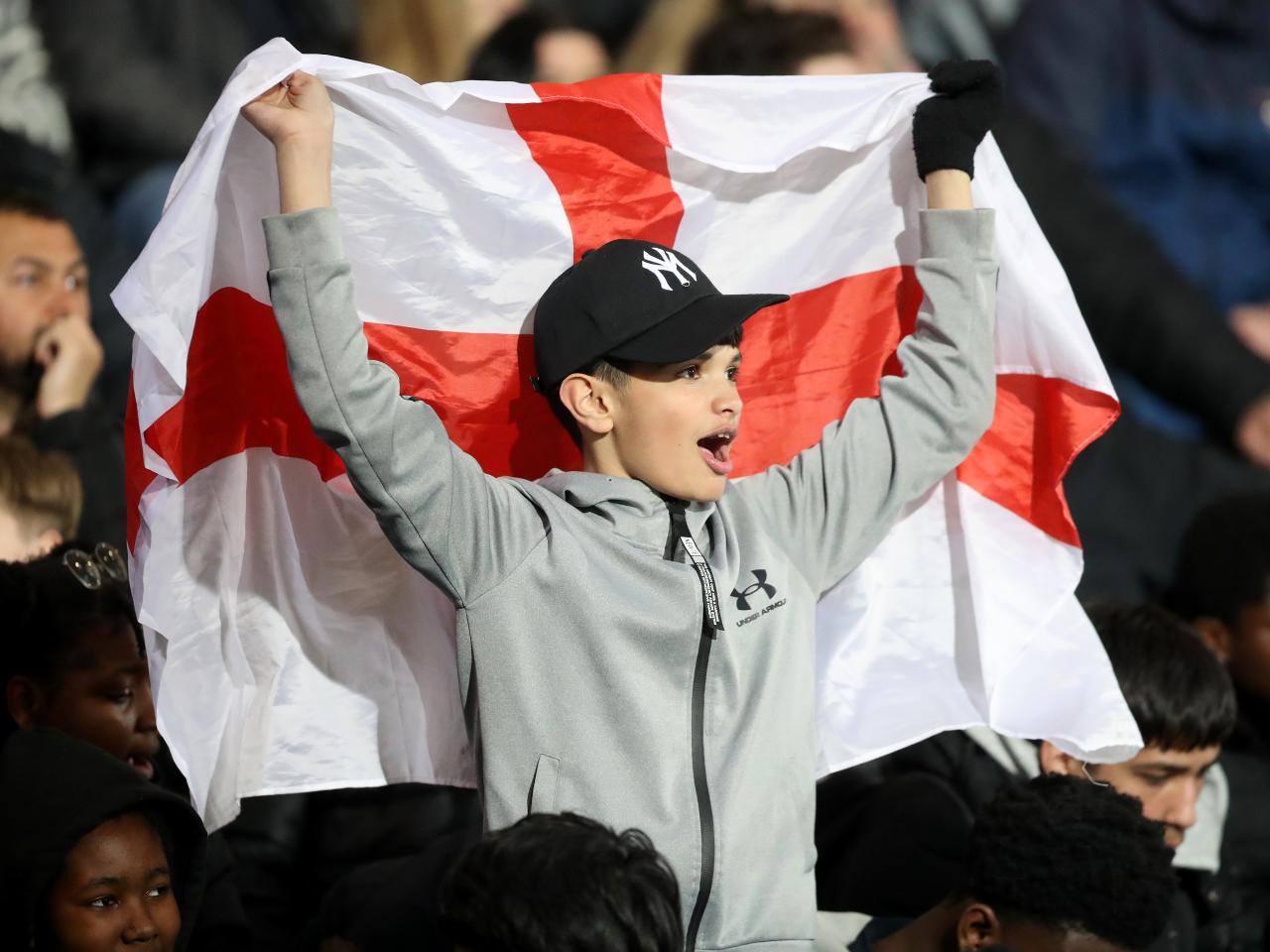England fan in the stands at The Hawthorns with England flag