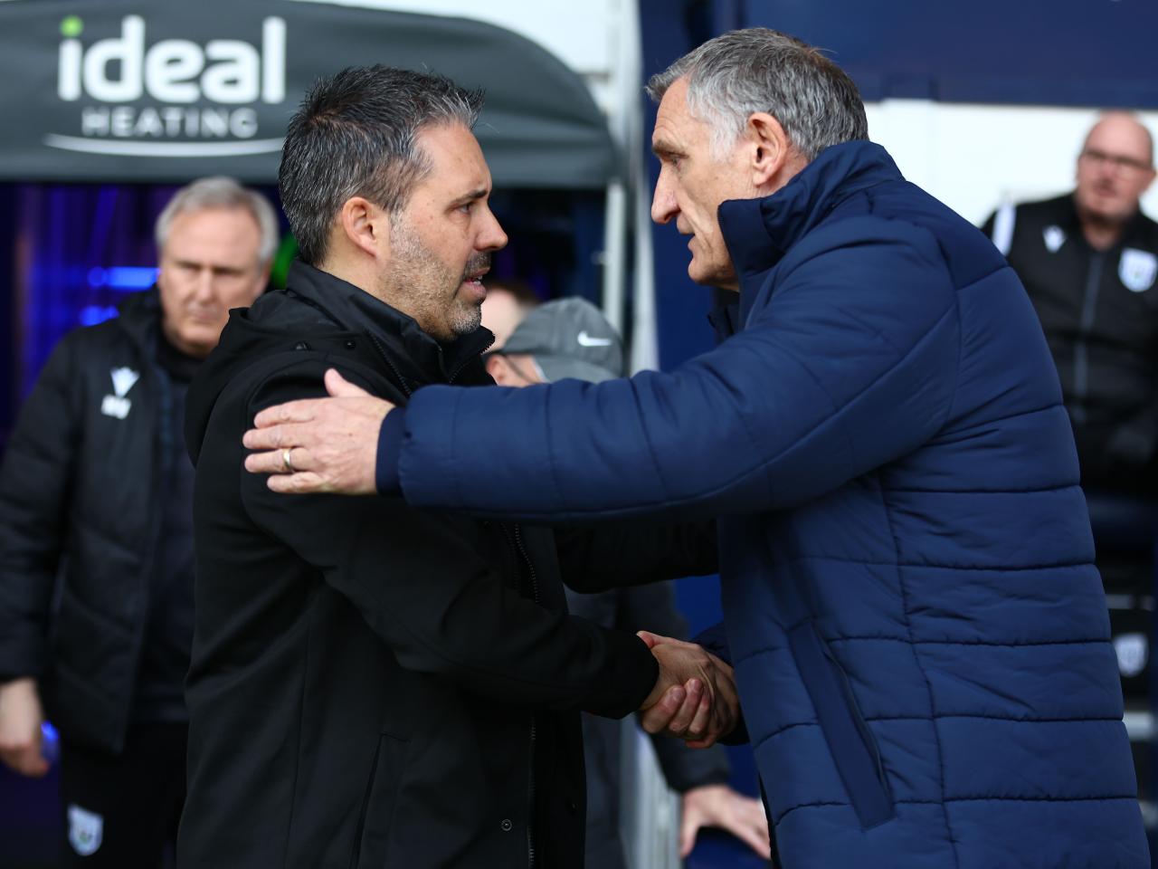 Marti Cifuentes and Tony Mowbray shake hands on the side of the pitch at The Hawthorns 