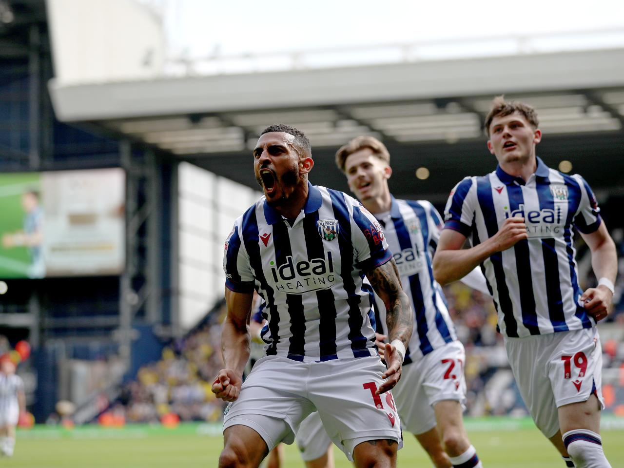 karlan Grant celebrates scoring against Watford with team-mates