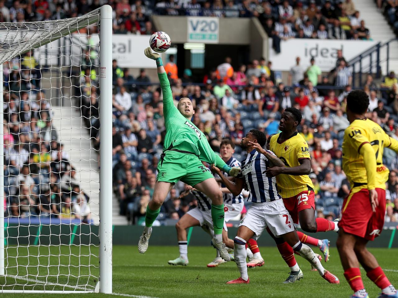 Watford's goalkeeper stretches to grasp the ball against Albion