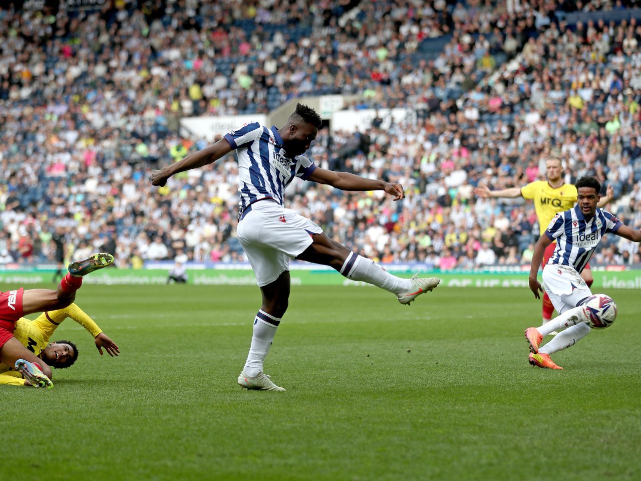Daryl Dike striking at goal against Watford
