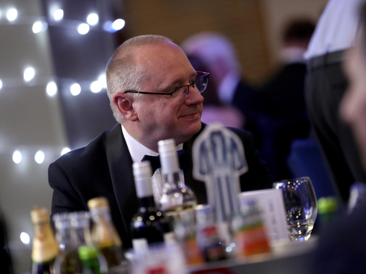 Mark Miles sat at a table at the end of season awards dinner