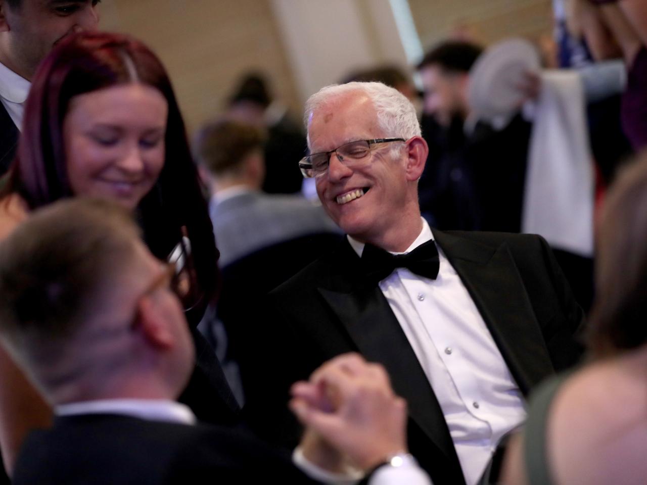 Rob Lake sat at a table at the end of season awards dinner