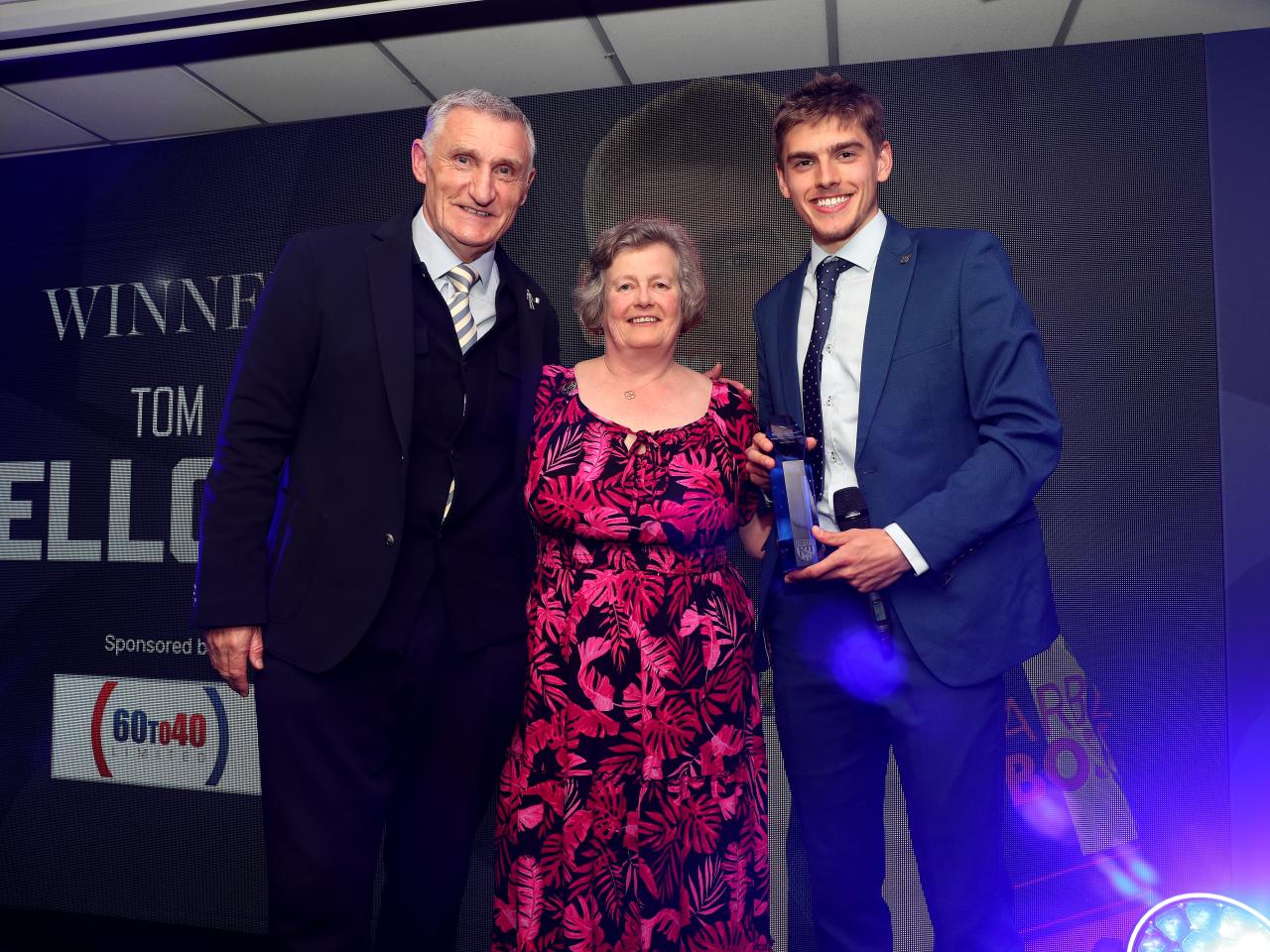 Tony Mowbray and Tom Fellows pose for a photo with a sponsor on stage at the end of season awards dinner