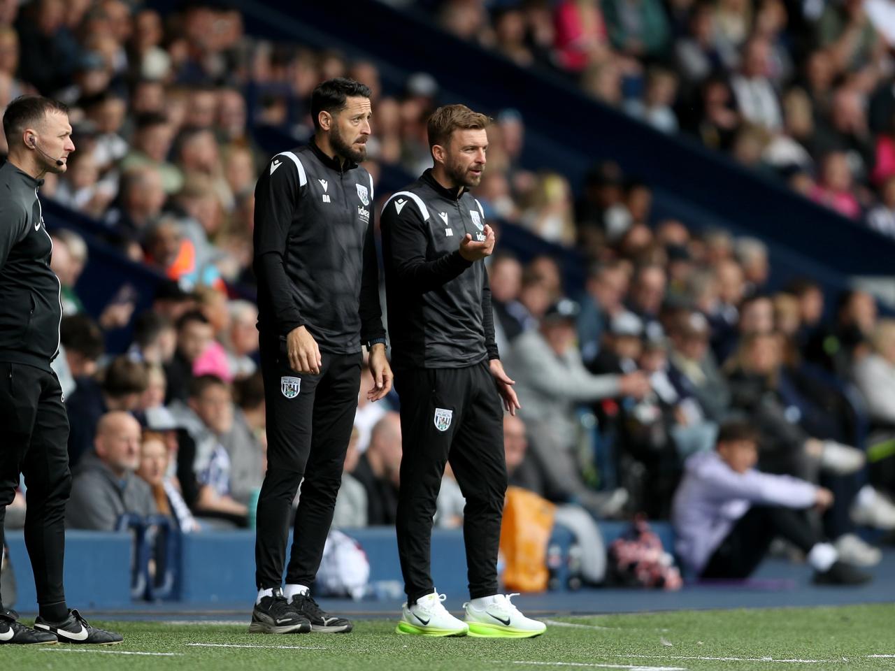 James Morrison on the side of the pitch with Damia Abella against Luton