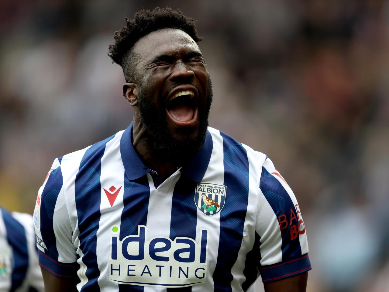 Daryl Dike celebrates after scoring against Luton Town