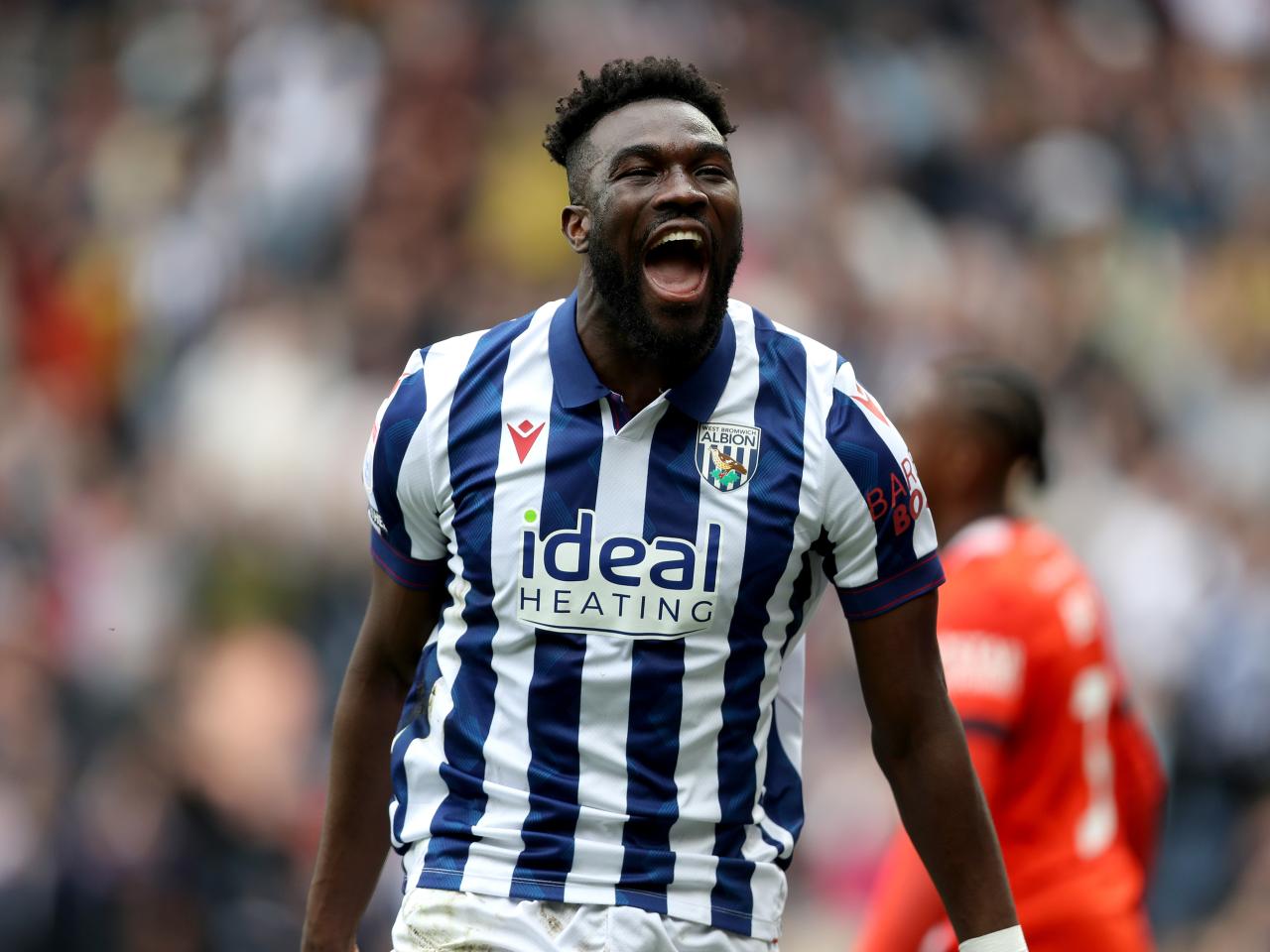 Daryl Dike celebrates after scoring against Luton Town