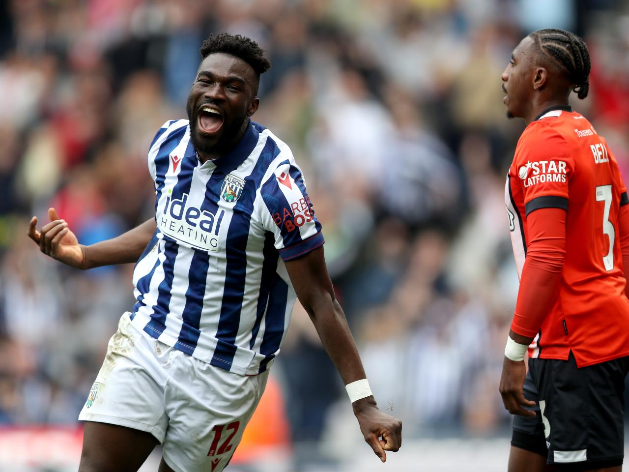 Daryl Dike celebrates after scoring against Luton Town
