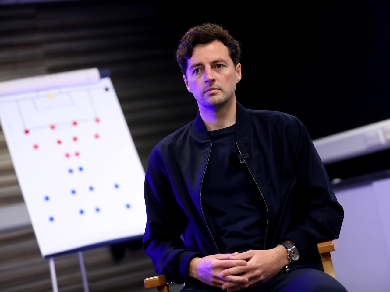 Ryan Mason sat in front of a tactics board