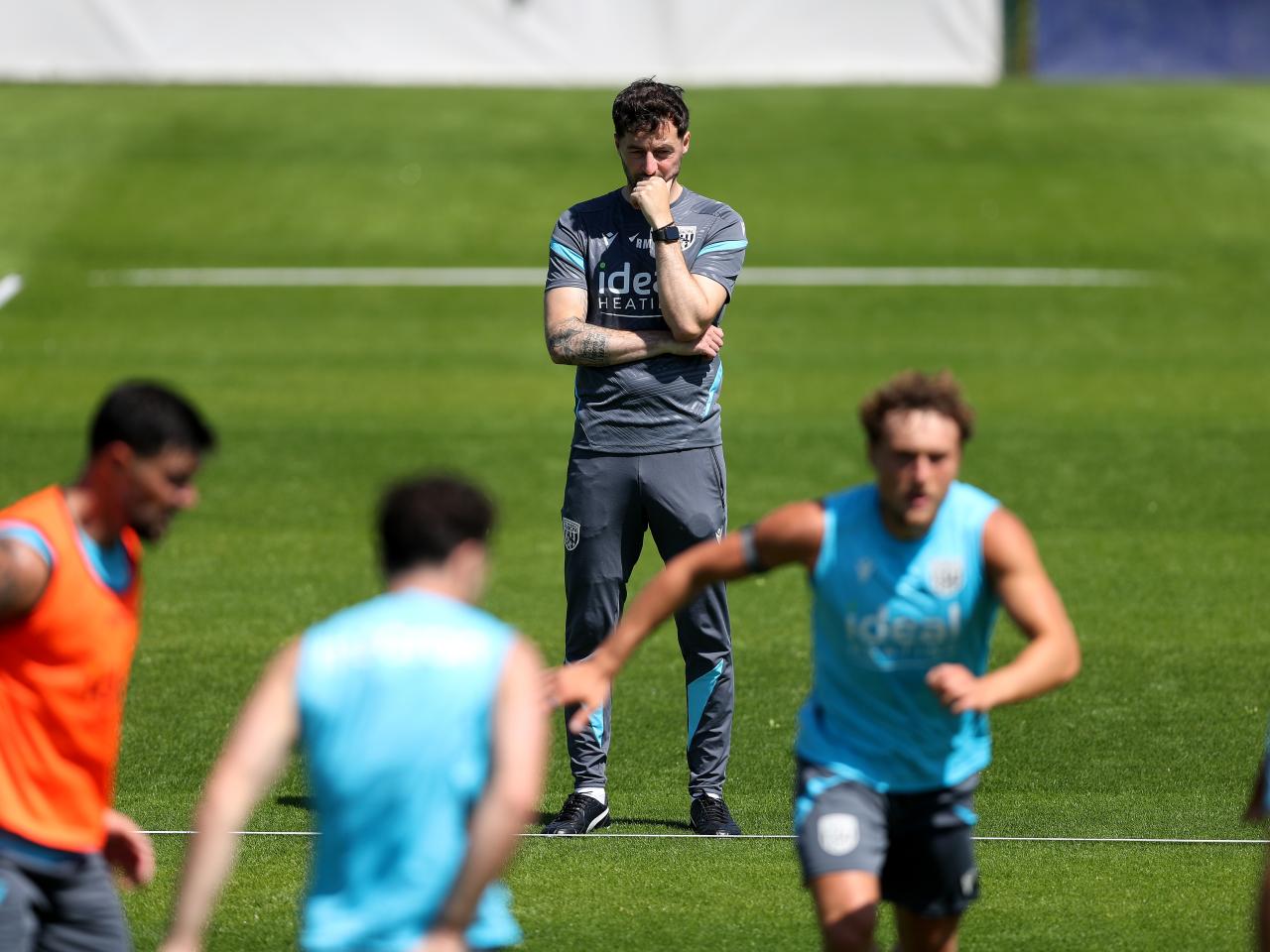 Ryan Mason in the background of a training session keeping watch