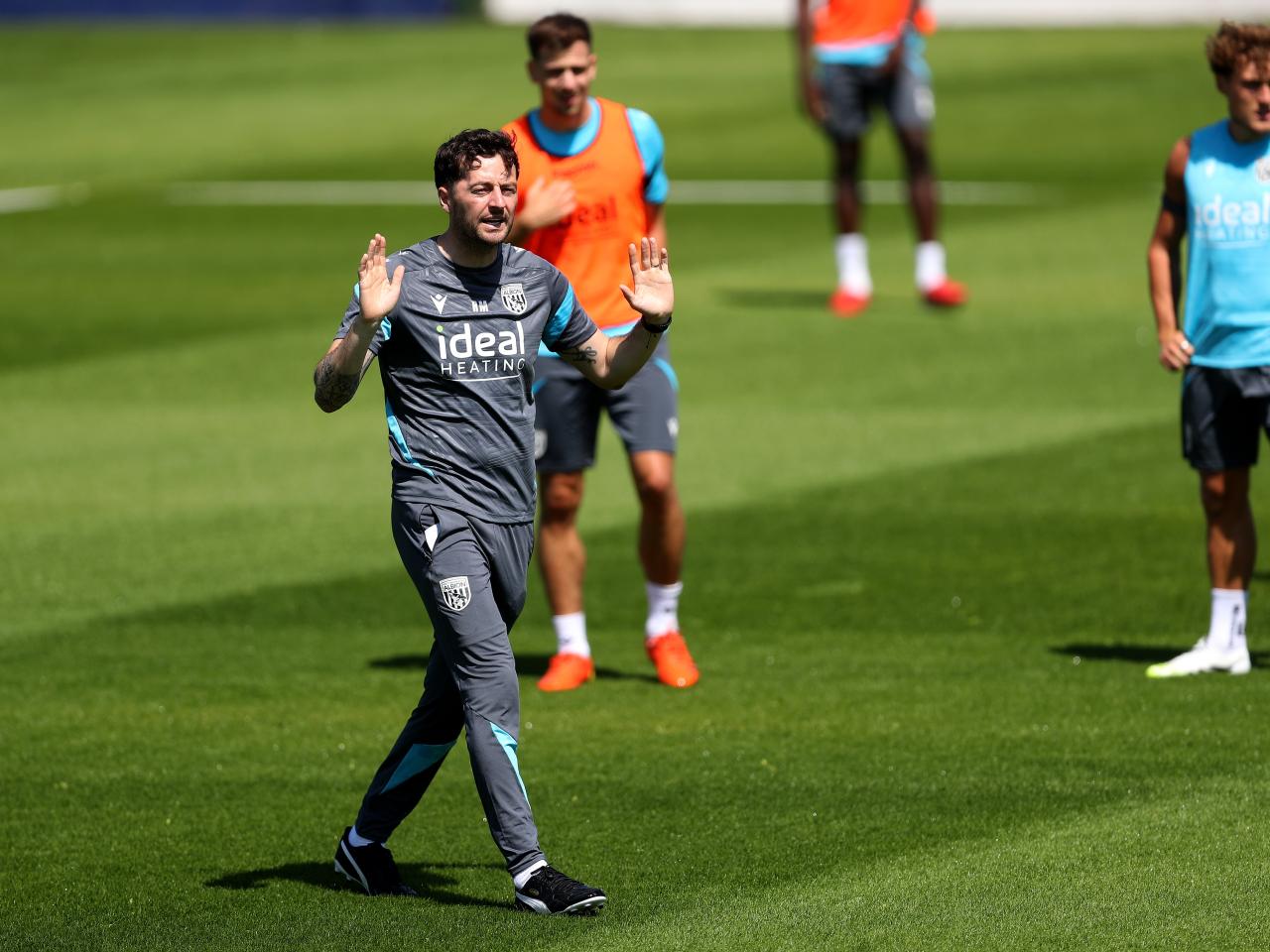 Ryan Mason delivering instructions to his players during a training session