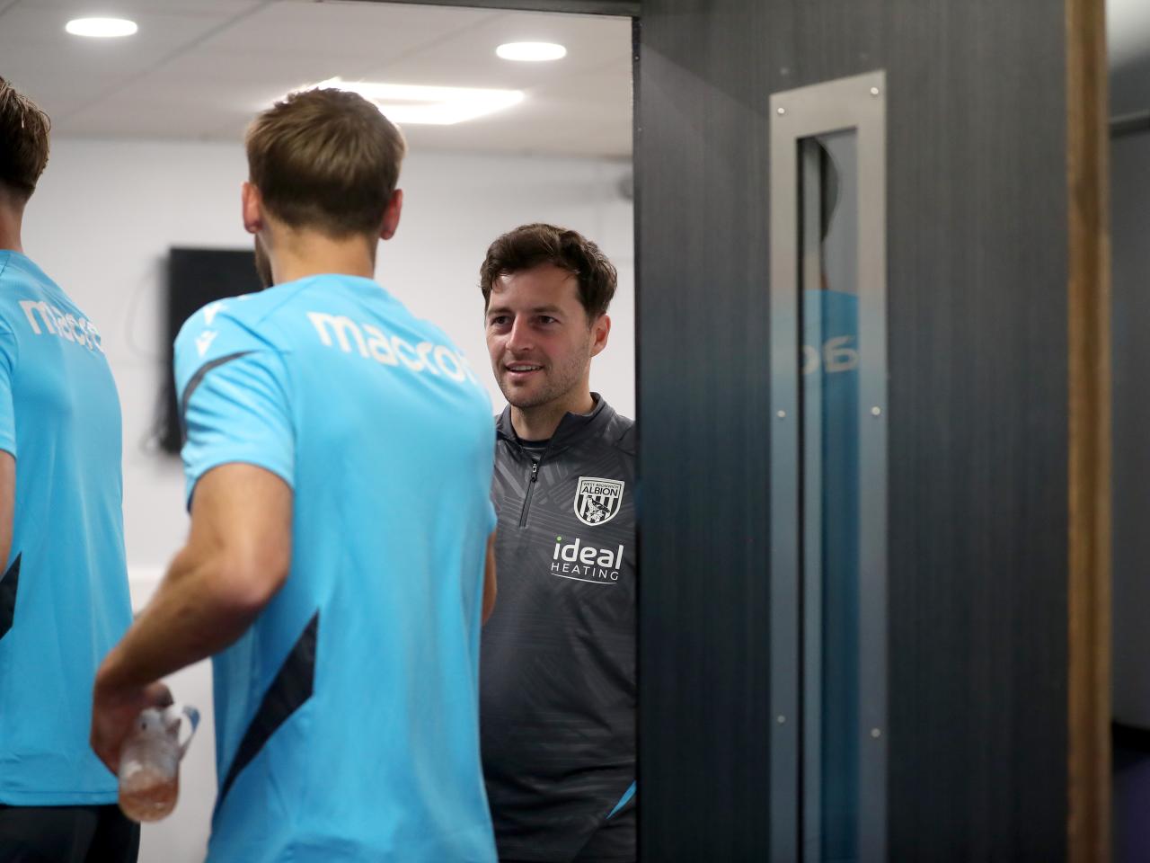 Ryan Mason greeting Albion players before a meeting