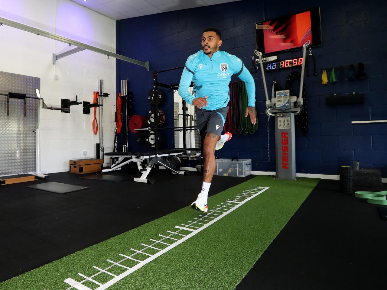 Karlan Grant carrying out a jumping test in the gym