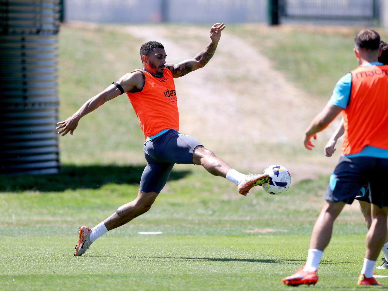 Karlan Grant stretching for the ball during a training session