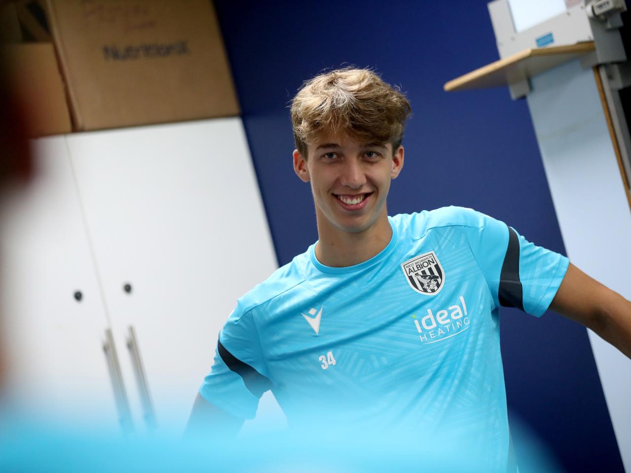 Harry Whitwell smiling at the camera while in the gym